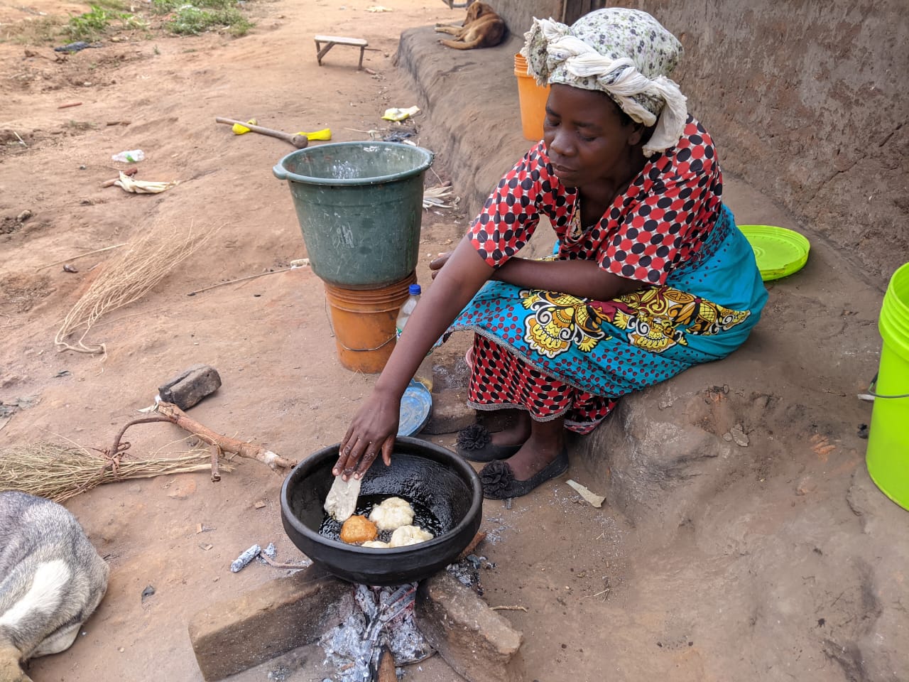 Woman cooking over a fire